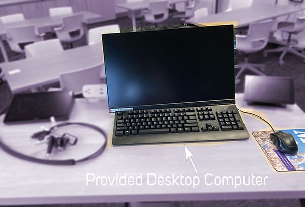 Tabletop with monitor, keyboard, cables, mouse, zoom device pictured. The words: "Provided Desktop Computer" are displayed next to an arrow.