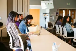 Seated attendees listen to the presentation.