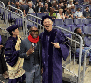 Dr. Kirk "Jae" James and Dean Michael Spencer pose together at the School of Social Work 2025 graduation.