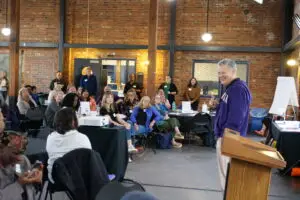 Dean Michael Spencer speaks in front of a room faculty and staff at the 2024 SSW retreat.
