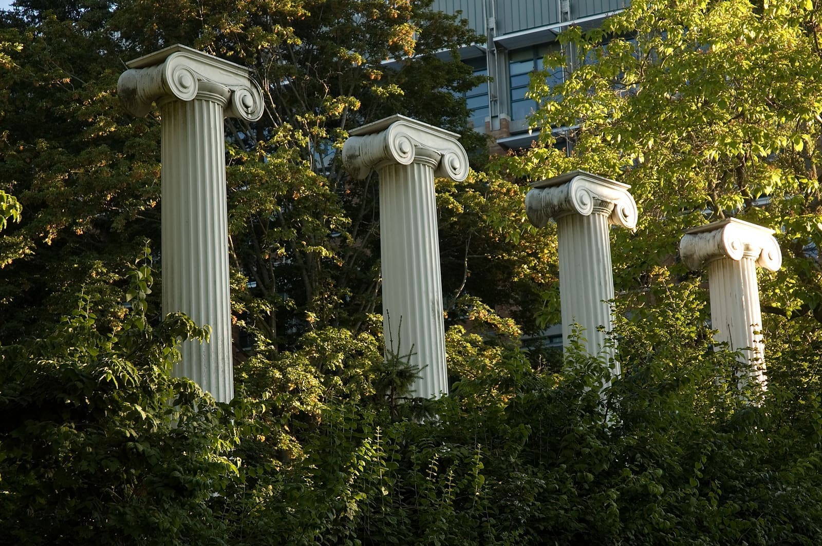 Sylvan Columns at the University of Washington surrounded by greenery.