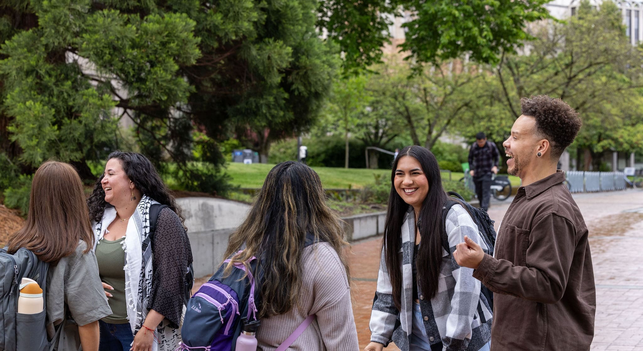 UW Students walking and talking on campus